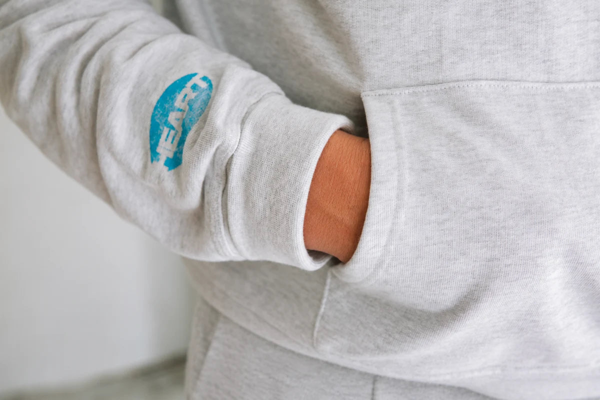 Ash heather sleeve and HEART print beside matching gray sweatpants